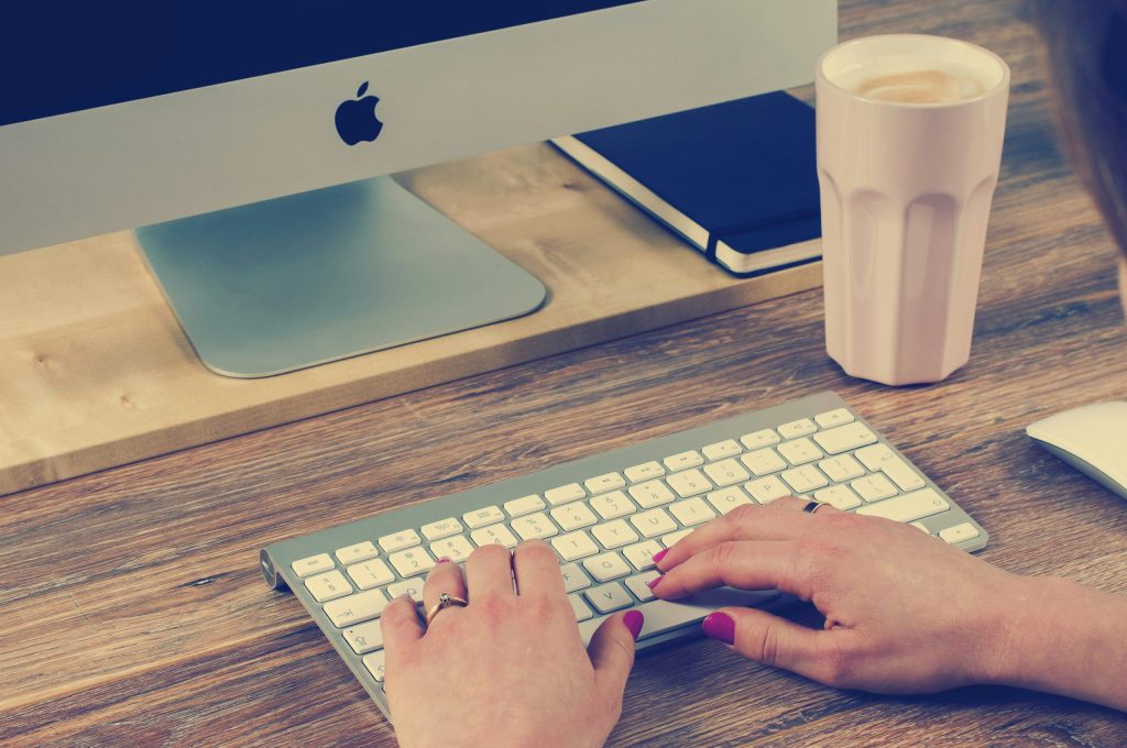 Copywriter Typing on Keyboard