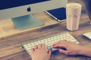 Copywriter Typing on Keyboard