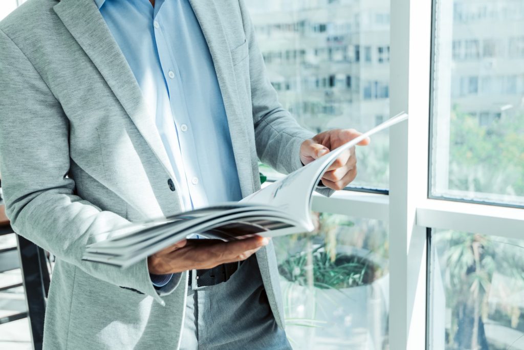 Man Reading Brochure