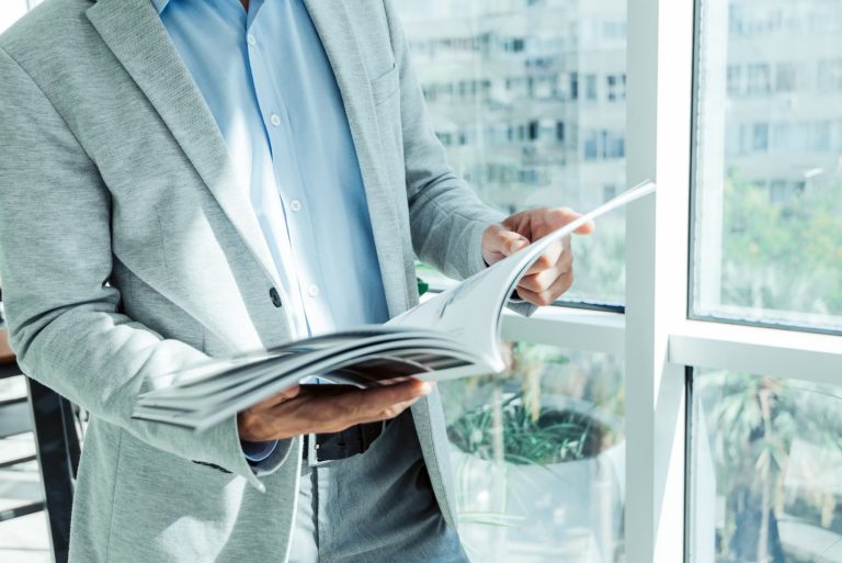 Man Reading Brochure